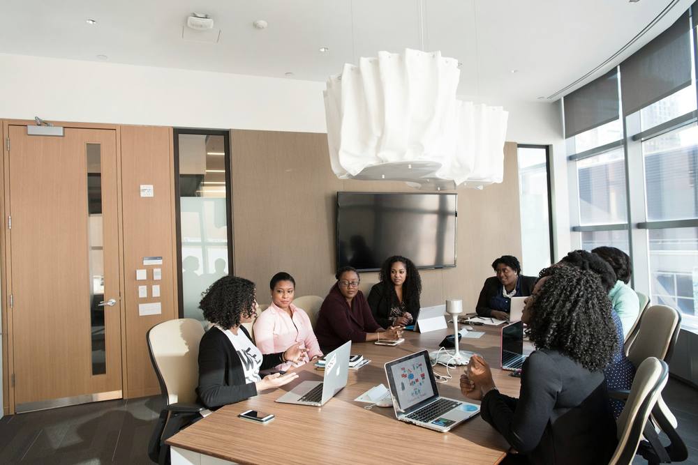 A sales team meeting around a boardroom table